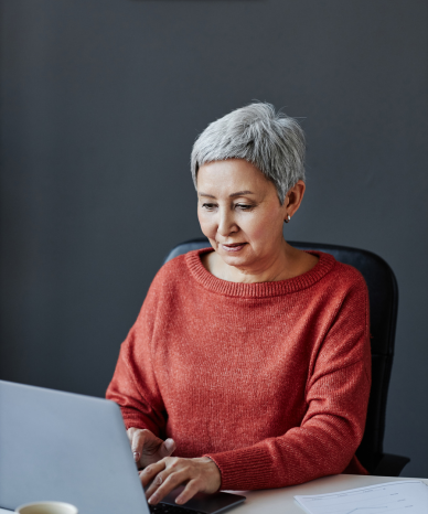 Elderly woman discussing workplace challenges during a consultation - Mercer Legal Group services.