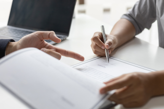 Handshake symbolizing agreement in an employment law case - Mercer Legal Group services.