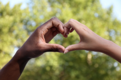 Heart symbol made with hands representing workplace integrity - Mercer Legal Group services.