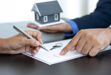 Person signing a real estate document - Mercer Legal Group services