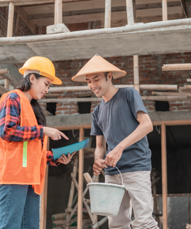 Workers on a construction site discussing legal rights - Mercer Legal Group services.