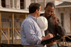 Construction workers consulting with legal professionals - Mercer Legal Group services.