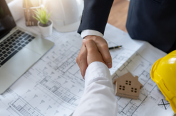 Hands shaking to symbolize agreements in workplace disputes - Mercer Legal Group services.