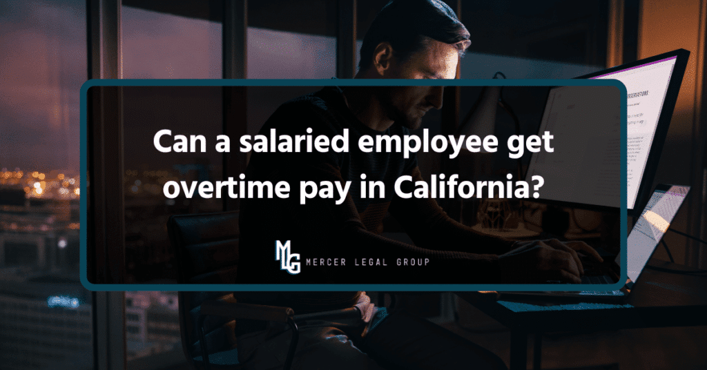 Salaried employee working late at a computer in an office, illustrating California overtime pay questions for exempt and nonexempt workers.