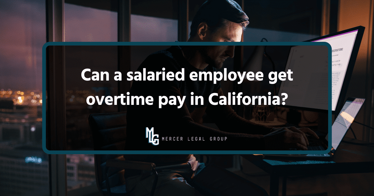 Salaried employee working late at a computer in an office, illustrating California overtime pay questions for exempt and nonexempt workers.